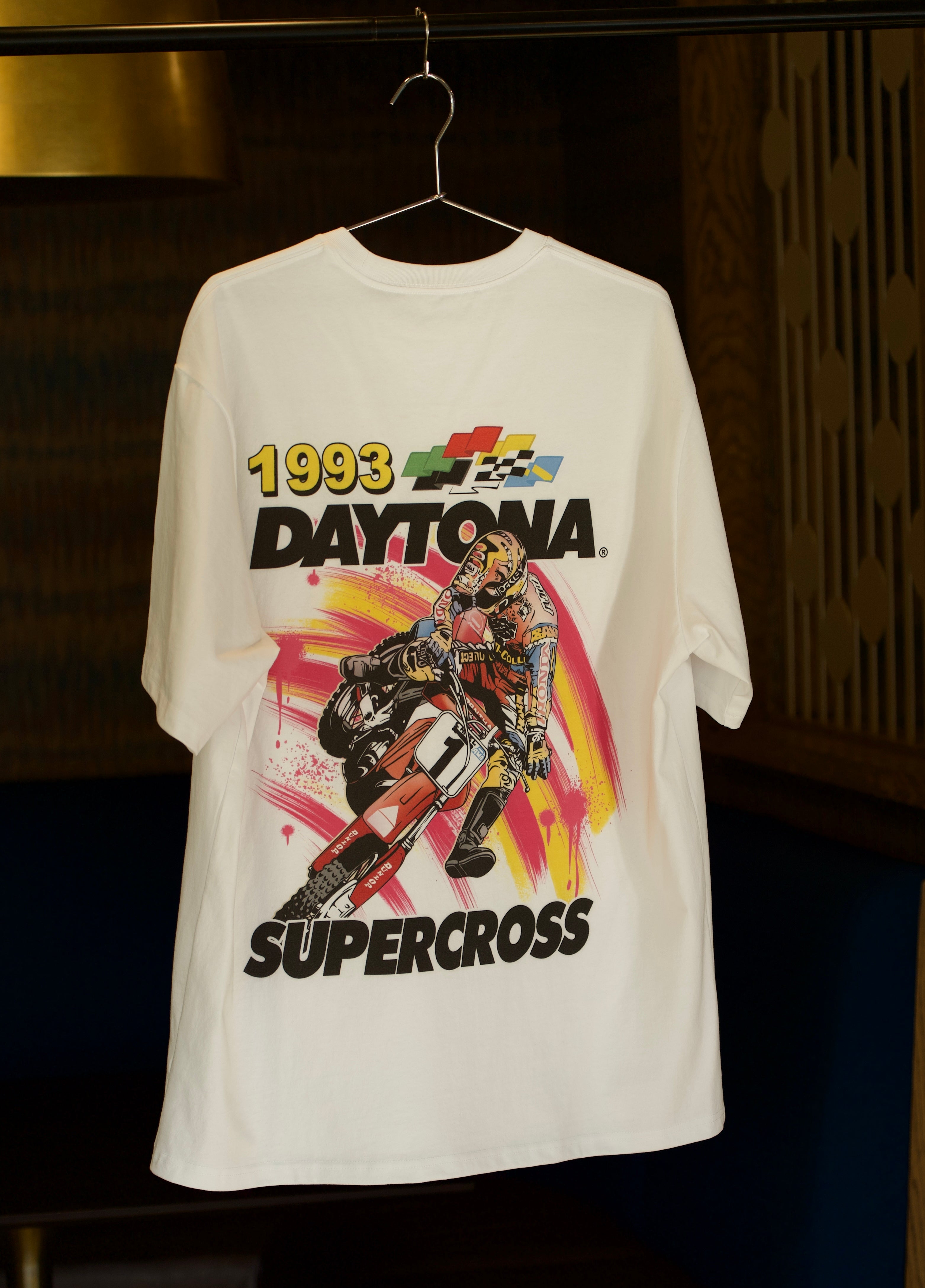 White t-shirt with 1993 Daytona Supercross graphic on a hanger.