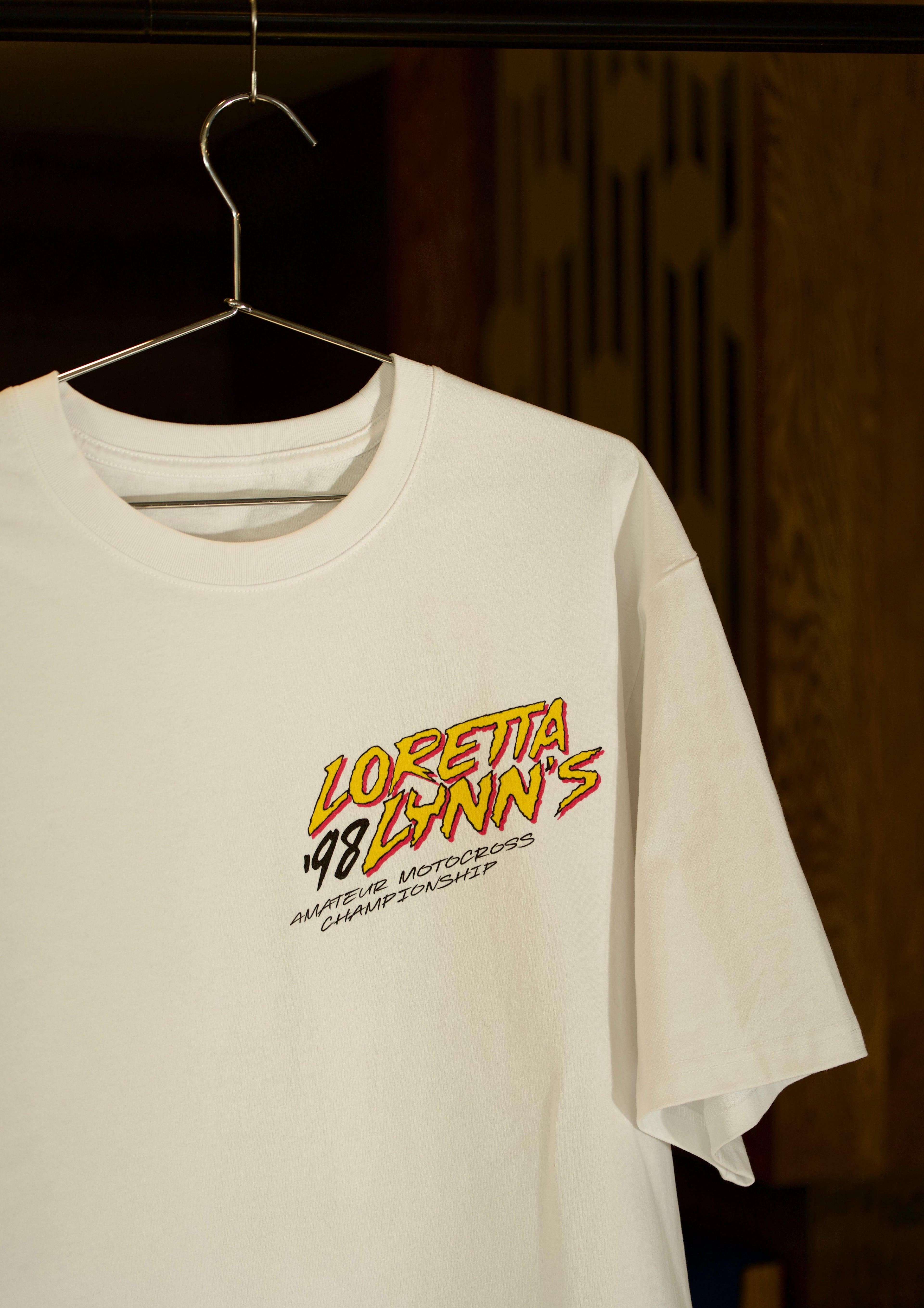 Loretta Lynn's motocross shirt in white color.