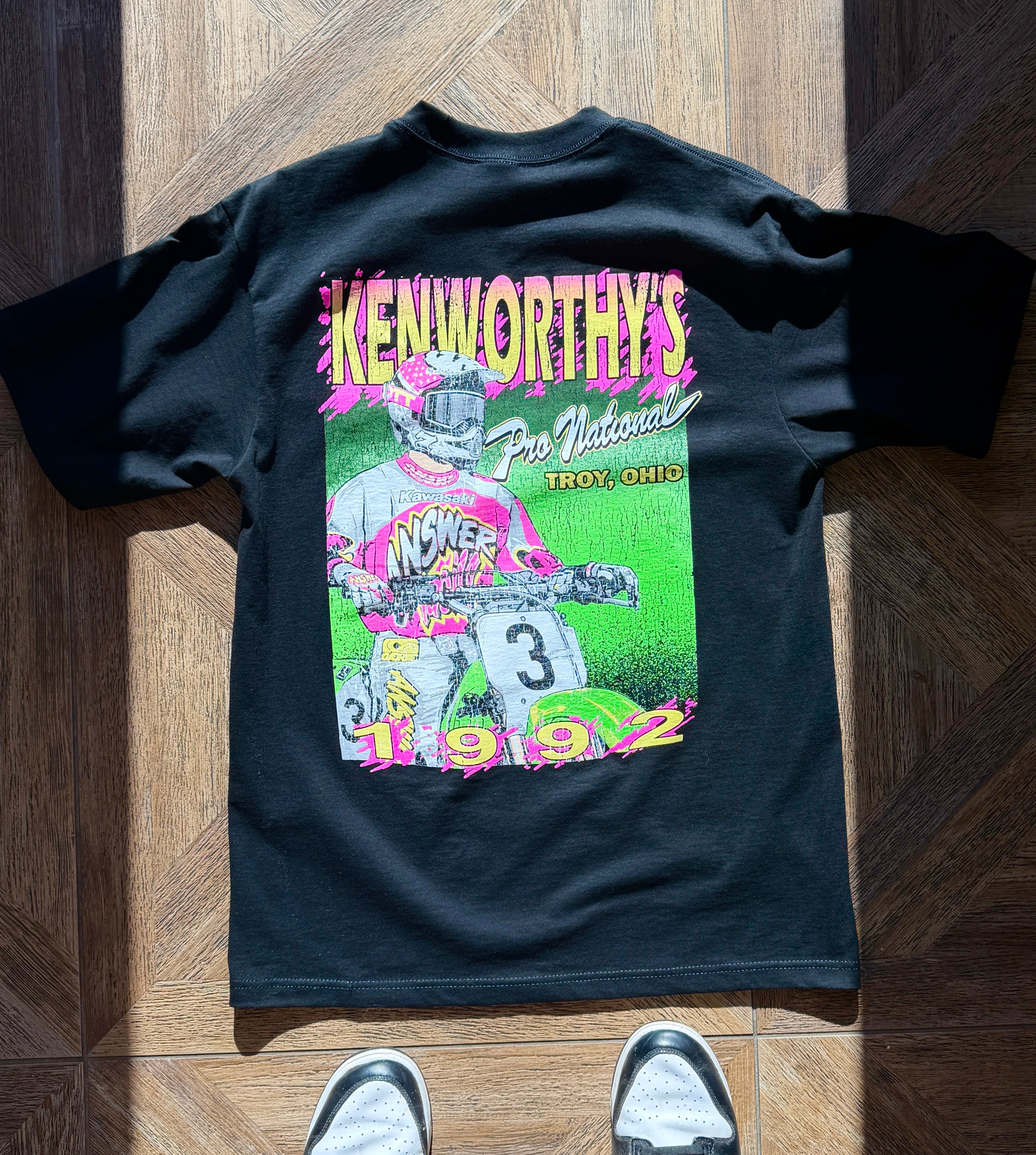 A black shirt with a graphic of the 1992 Kenworthy's Pro Motocross Nation in Troy, OH.